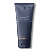 Das Bild zeigt eine marineblaue Rasiercremetube von „The Gentleman Floris London“ mit dem Markennamen in Weiß und einer hellblauen Linie darunter, sowie zwei königlichen Wappen, die Hoflieferantenauszeichnungen andeuten. Die Produktbezeichnung „No. 89 SHAVING CREAM“ und die Größe „100 ml“ sind ebenfalls vermerkt.